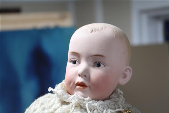 A Heubach character doll, intaglio eyes on shoulder plate broken, 18in., a Heubach character baby, intaglio eyes, hard body, 9in. and a